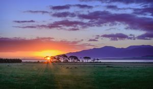 Beautiful sunset, farmland and mountains, great photography in new zealand